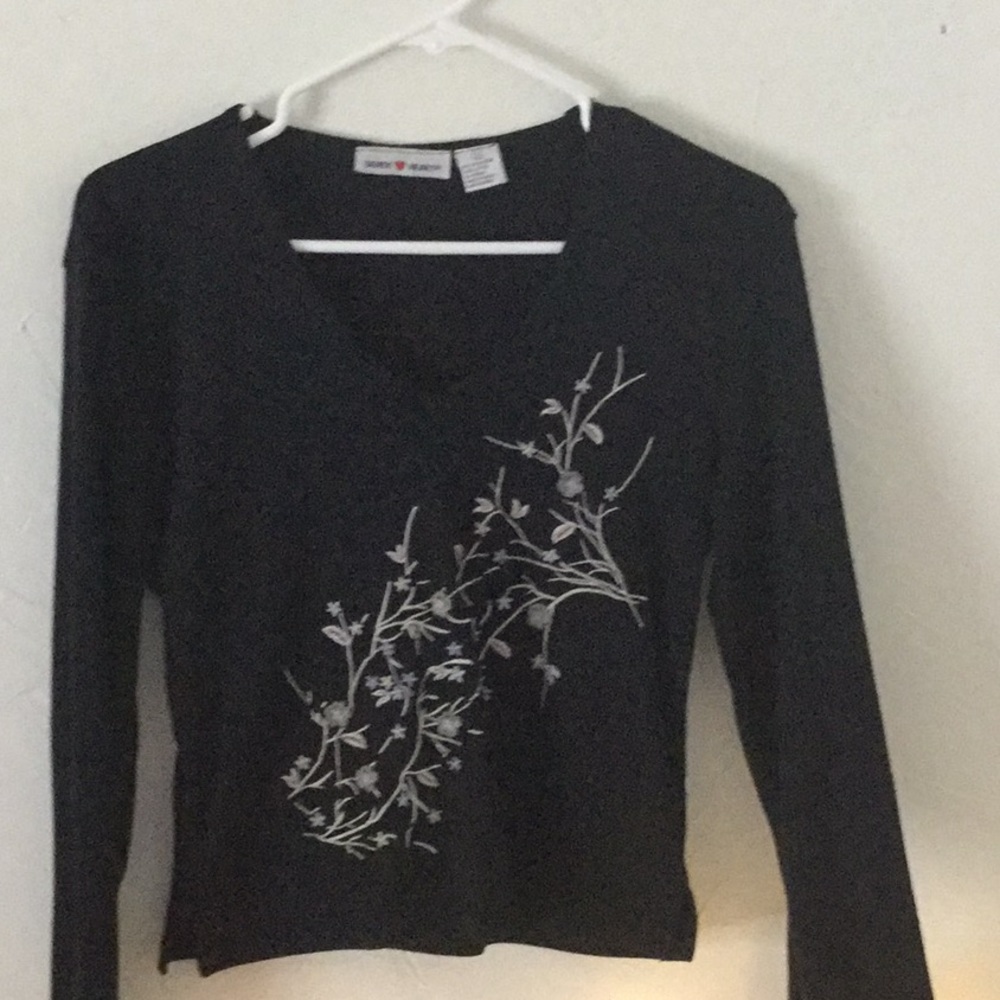 Black embroidered shirt.